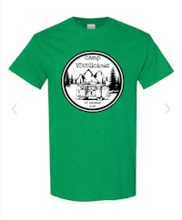 a green t - shirt with a logo of a cabin and trees