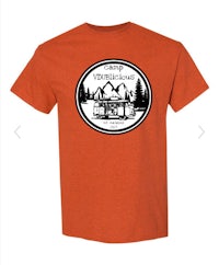 an orange t - shirt with a logo of a cabin and trees