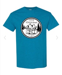 a blue t - shirt with the logo of a mountain lodge